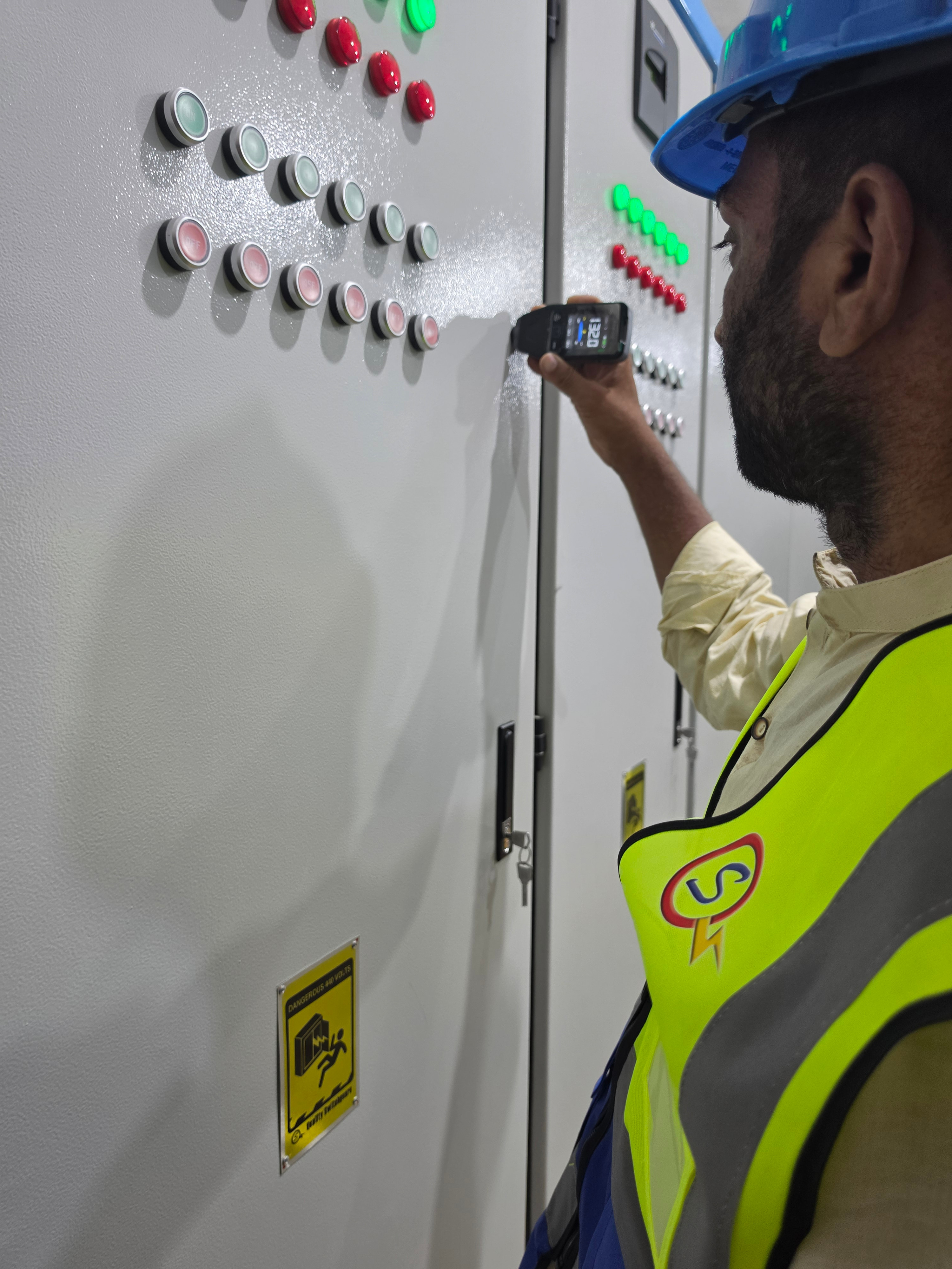 Technician verifying a finished board before site handover.